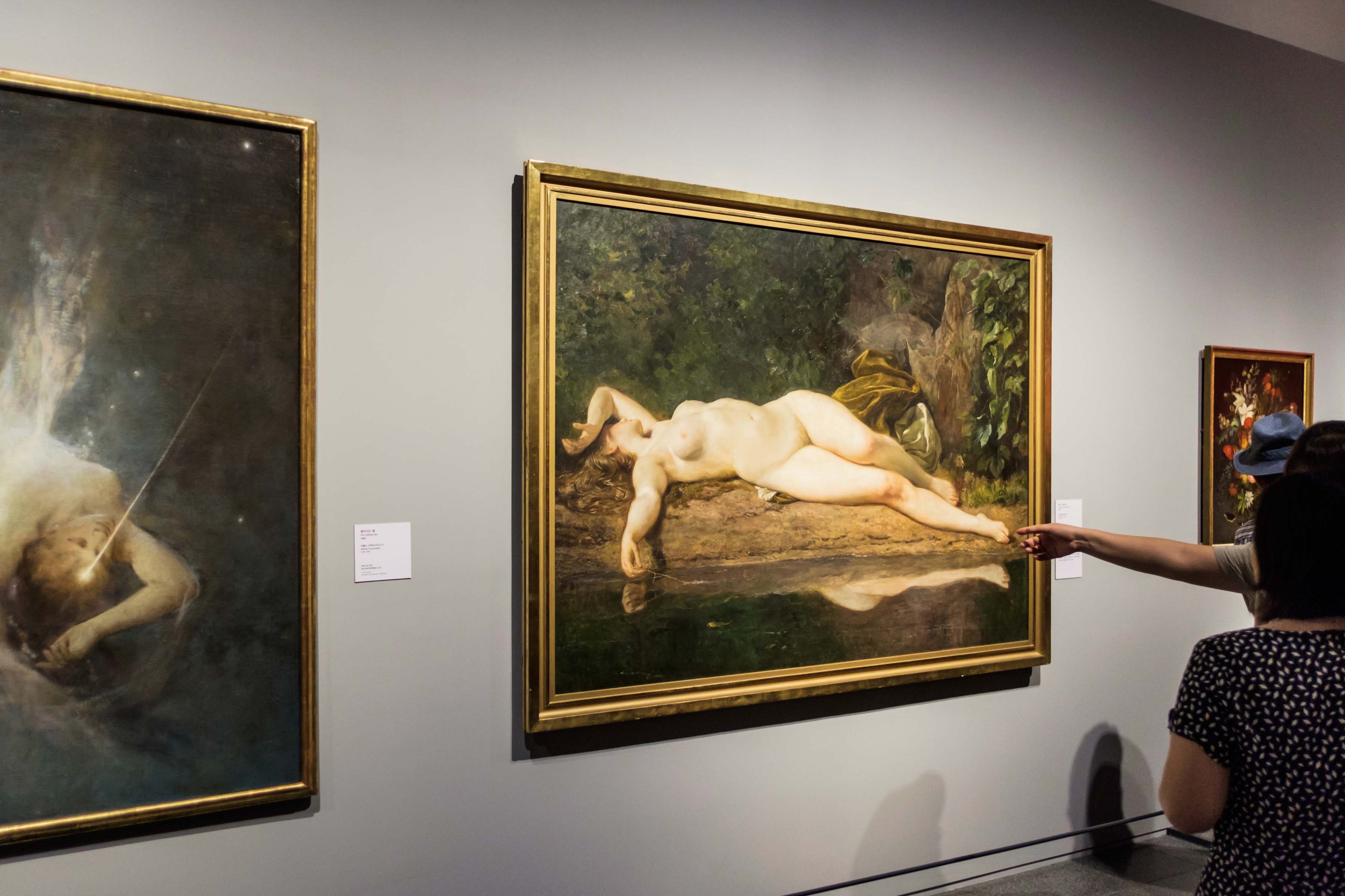 Visitors viewing paintings in a National Museum of Korea gallery