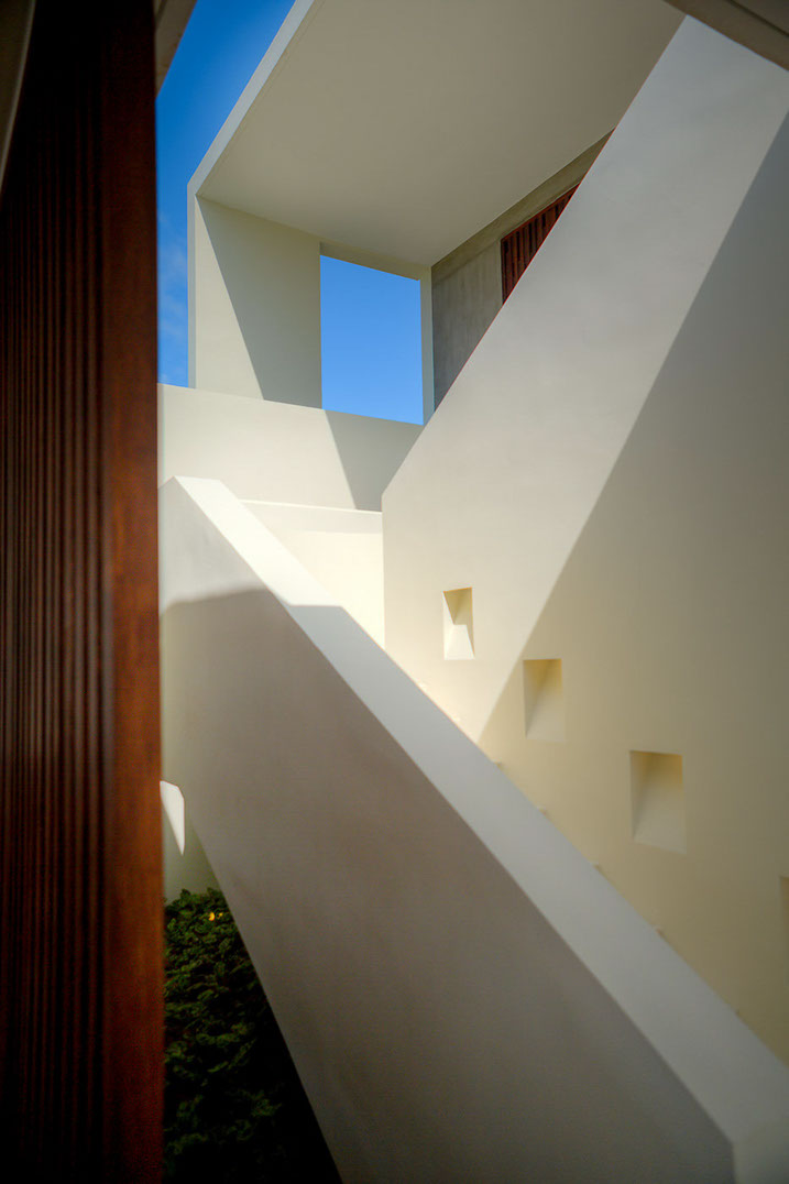 Sunlit stairway inside a Samujana residence
